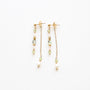 Boucles d'oreilles en péridot vert à chaîne, acier inoxydable doré.