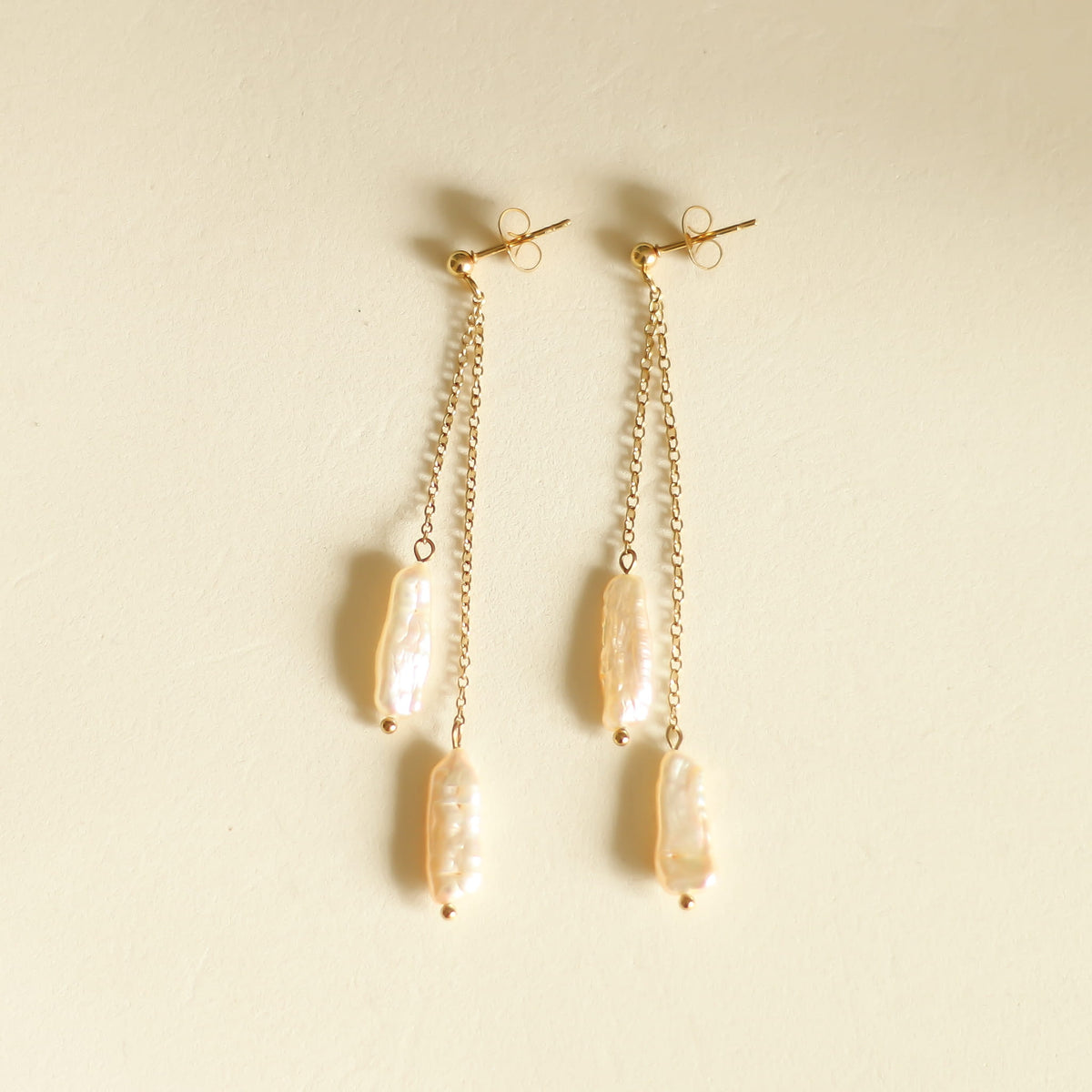 Boucles d'oreilles Perles orangées longues chaîne