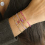 Bracelet perlé en Améthyste violette translucide et perles dorées 