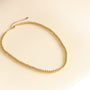 le cadeau simple collier à boules dorées