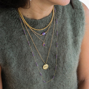 collier sautoir assemblé à Paris en acier inoxydable et médaillon 