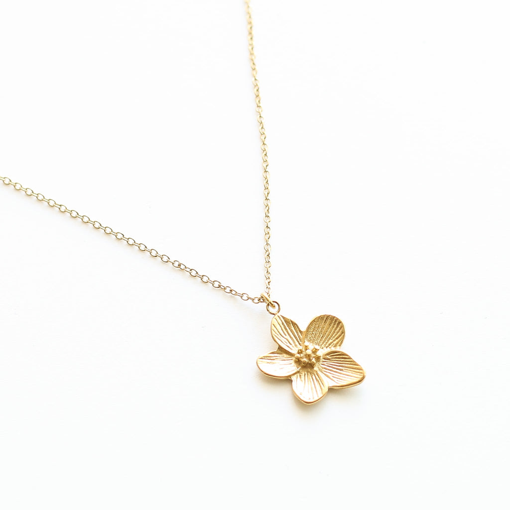 collier long fleur tiaré acier doré