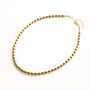 Collier en hématite dorée, acier inoxydable doré.