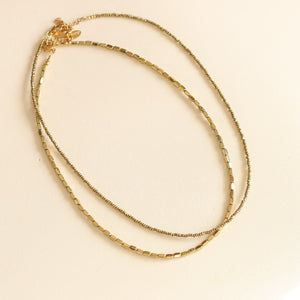 collier fin en perles d'Hématite dorées