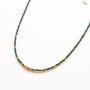 Collier Malachite perlé fin, gros plan sur la pierre, pierre véritable, signé Mahny.