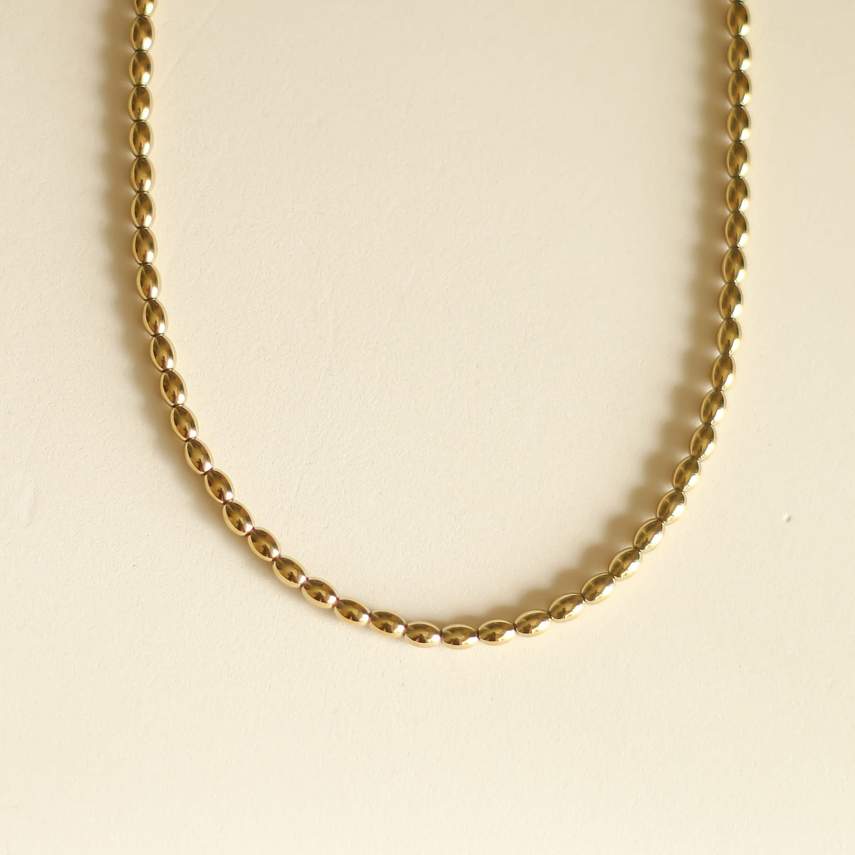 Collier Hématite dorée tonneau