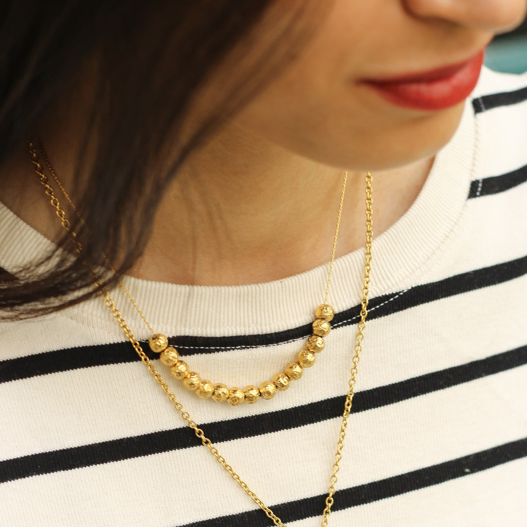 collier acier inoxydable perle dorée