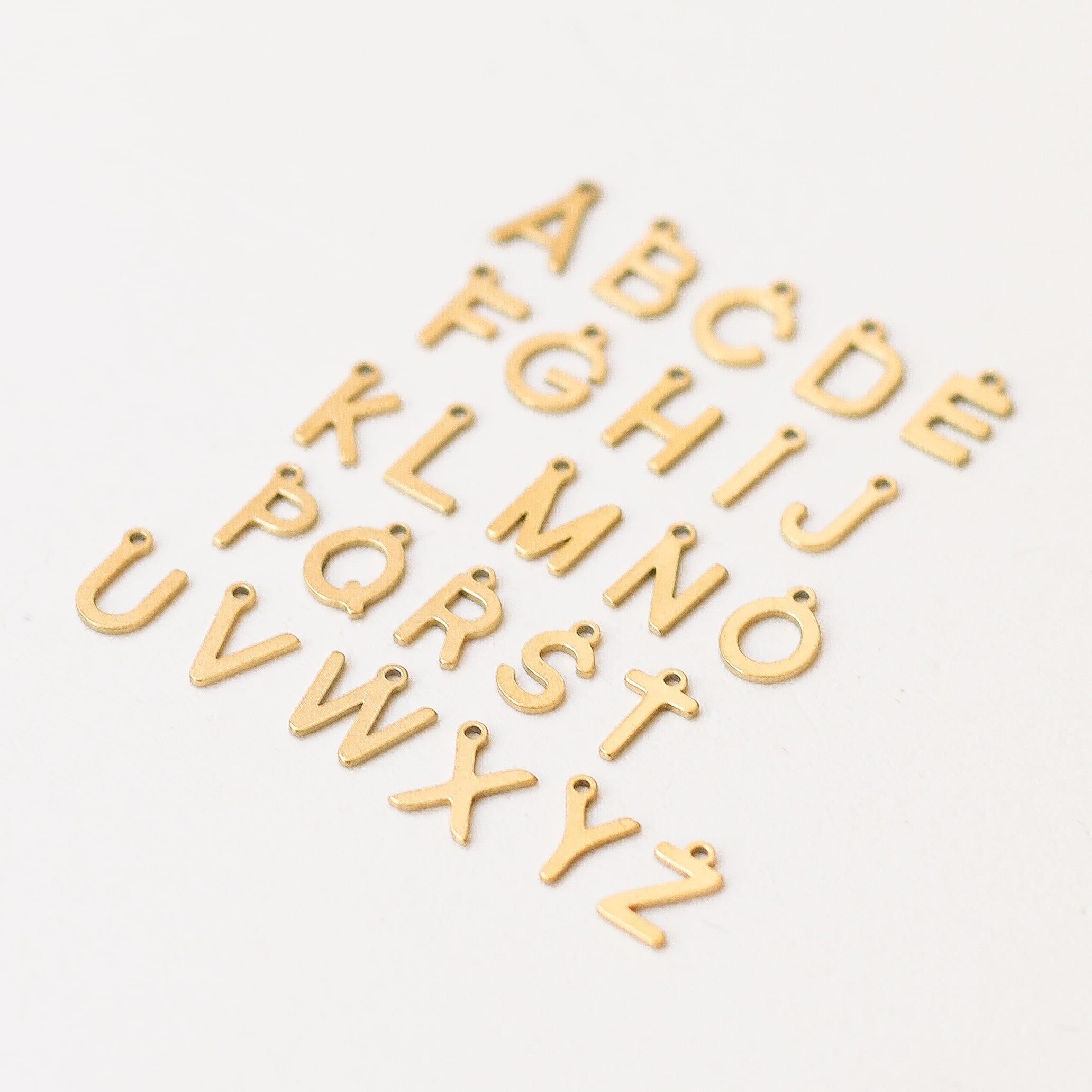 pendentif lettre acier inoxydable créatrice